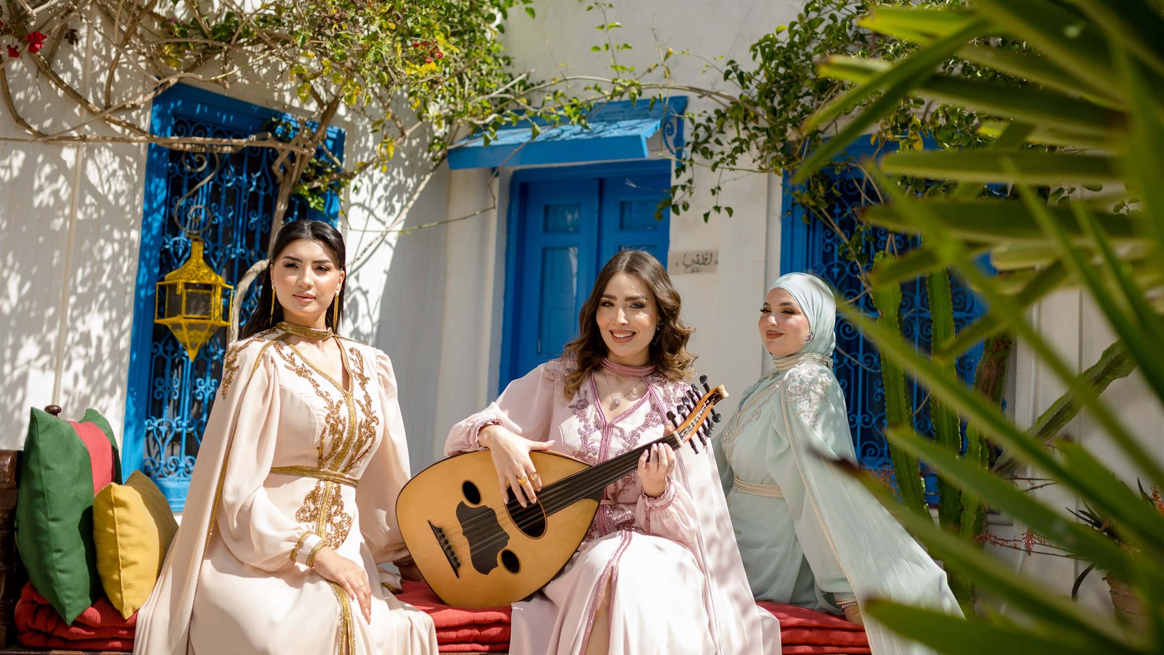 Lamassat cream caftans styled in a courtyard